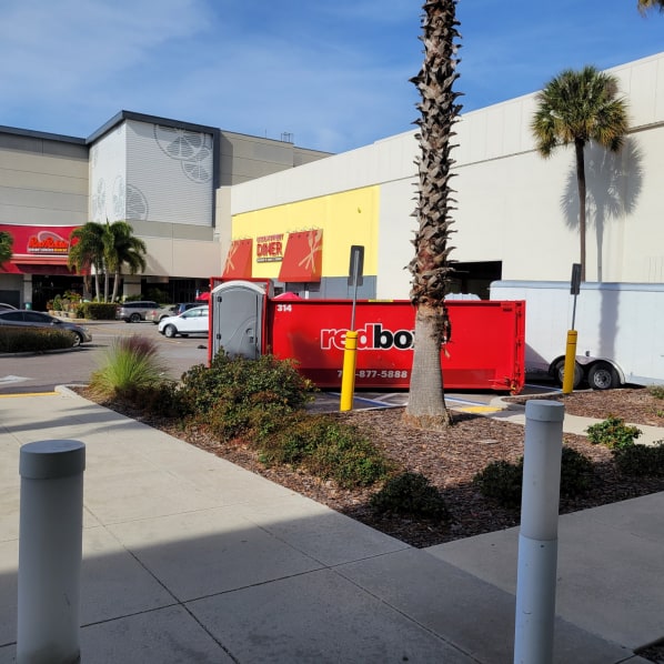 redbox+ of the suncoast dumpster rental in front of residential home