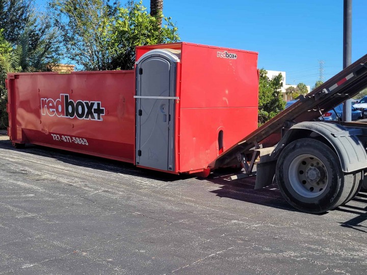 redbox+ dumpster in front of business