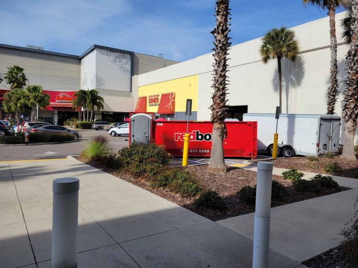 redbox+ of the suncoast dumpster rental in front of residential home