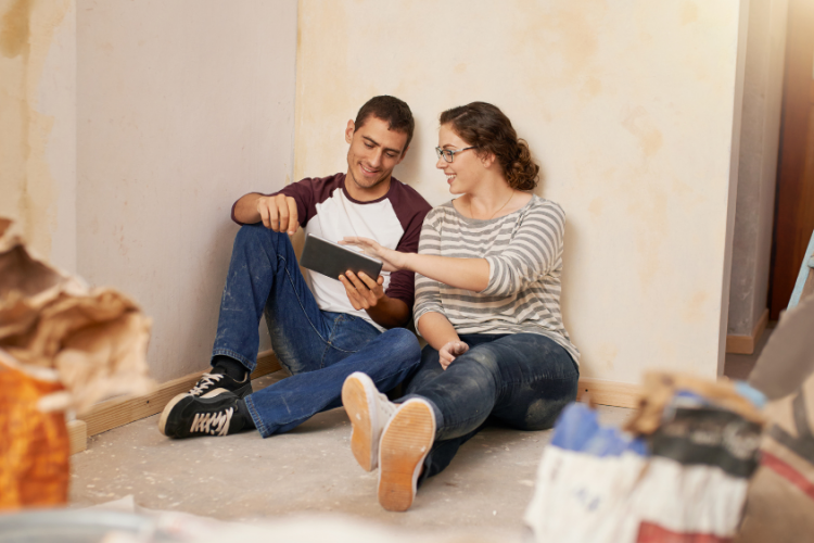 couple sitting in home remodel