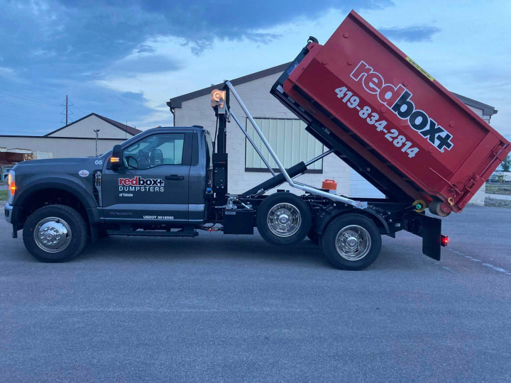 mini dumpster rental on truck in Toledo