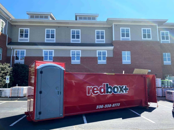 dumpster in front of apartment complex