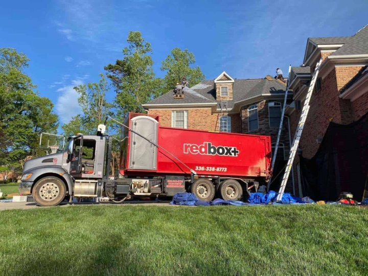 our elite dumpster is being delivered for a roofing contractor