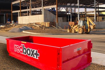 40-yard dumpster in front of a building under construction