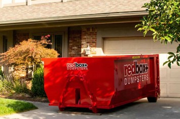 Yard Waste Dumpster in front of house